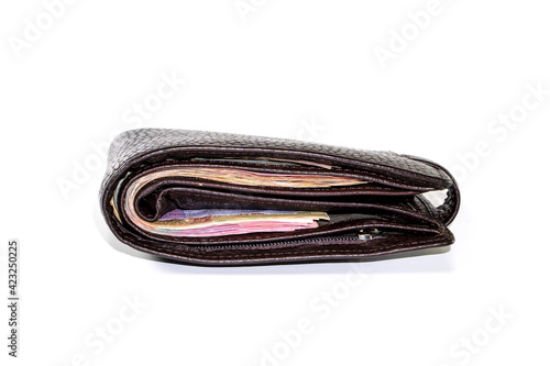 Money in black leather wallet isolated on white background. money concept