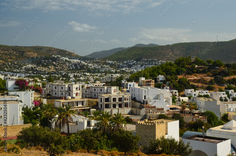 Panoramic View of Bodrum downtown, traditional white houses marina.  Landscape of Traditional Bodrum Aegean architecture style . Vacation in Turkey