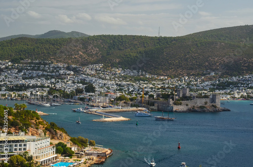 Panoramic View of Aegean sea, traditional white houses marina and Bodrum Castle in Bodrum city of Turkey. Aegean traditional style architecture. Bodrum bay. View from hight © Iryna