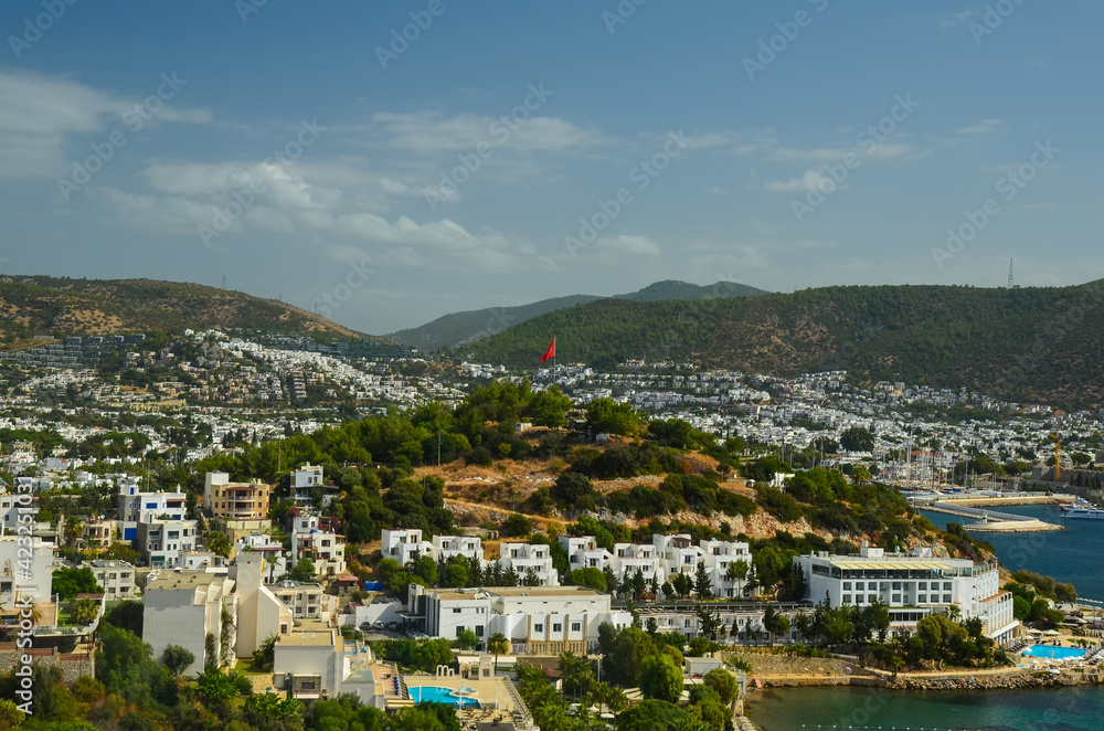 Panoramic View of Bodrum downtown, traditional white houses marina.  Landscape of Traditional Bodrum Aegean architecture style . Vacation in Turkey
