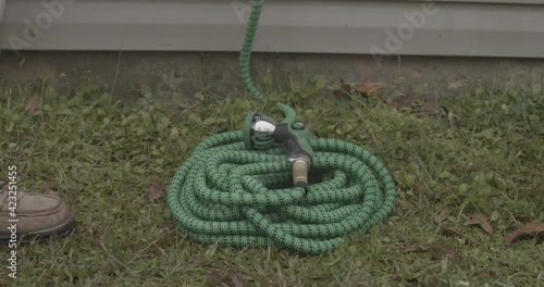 Expanding garden hose triples in size as water fills it.