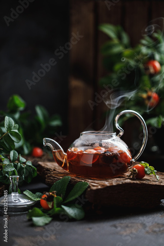 Rosehip tea with rosehip berries. Rosehip tea kettle photo