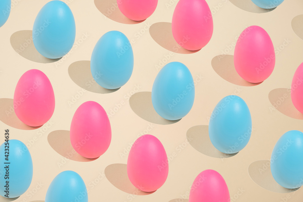 2021 Easter bold and minimal still life composition. Pink and blue eggs arranged on beige background. Trendy minimal concept. 2021 Easter bold and minimal still life composition. Pink and blue eggs arranged on beige background. Trendy minimal concept.