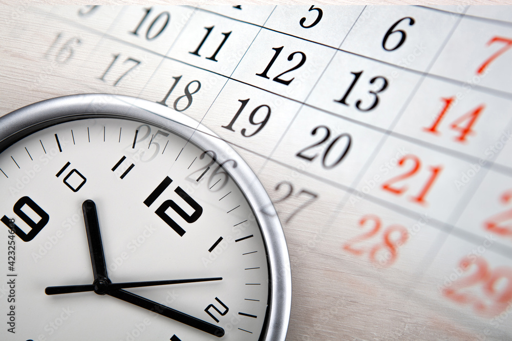 large white clock face with calendar sheets large white clock face with calendar sheets