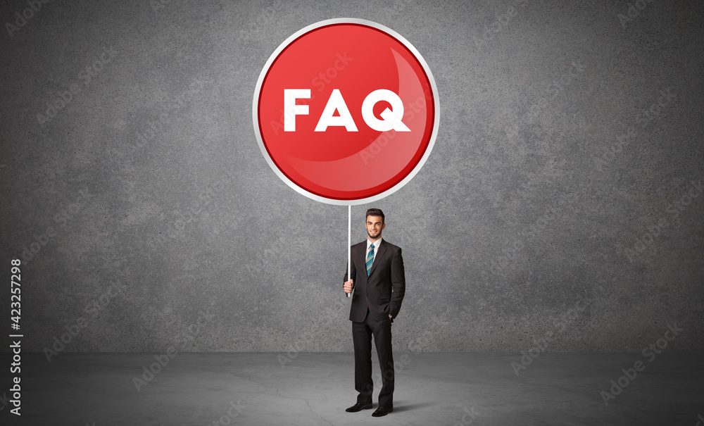 Fototapeta premium Young business person holdig traffic sign