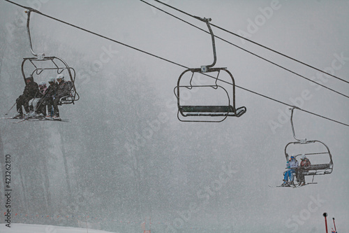 Bild auf Leinwand Ski Lift in Snowy and Foggy Weather
