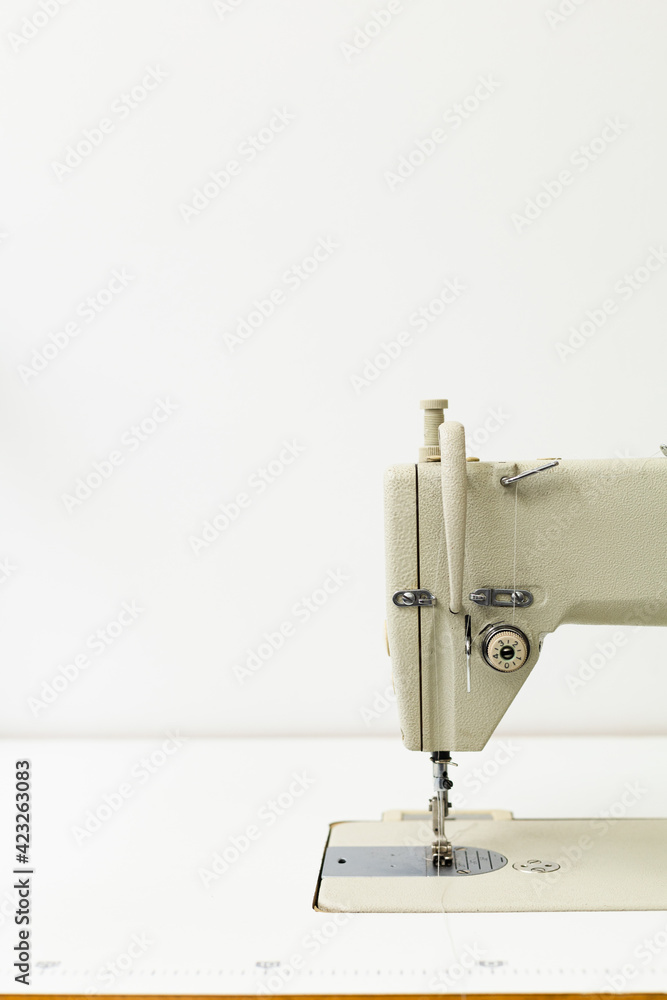 Industrial sewing machine on a white background