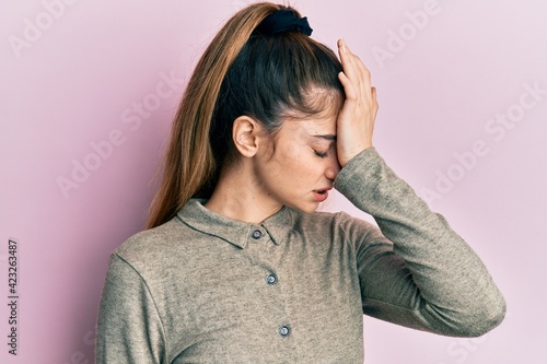 Young caucasian woman wearing casual clothes surprised with hand on head for mistake, remember error. forgot, bad memory concept. © Krakenimages.com