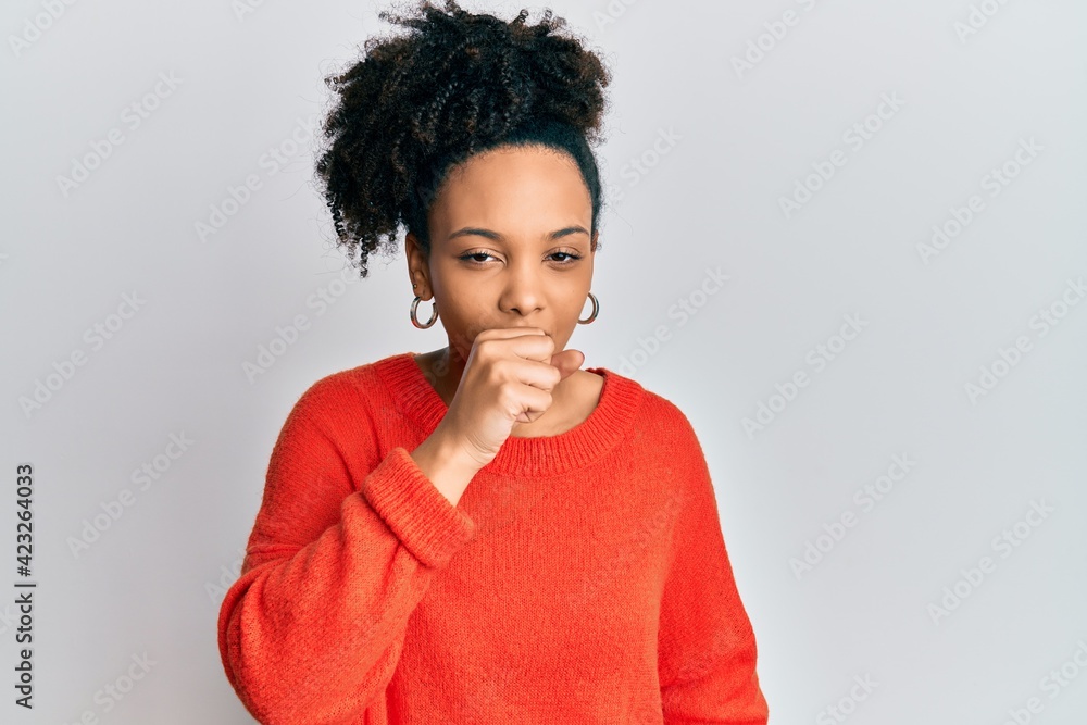 Young african american girl wearing casual clothes feeling unwell and coughing as symptom for cold or bronchitis. health care concept. Young african american girl wearing casual clothes feeling unwell and coughing as symptom for cold or bronchitis. health care concept.