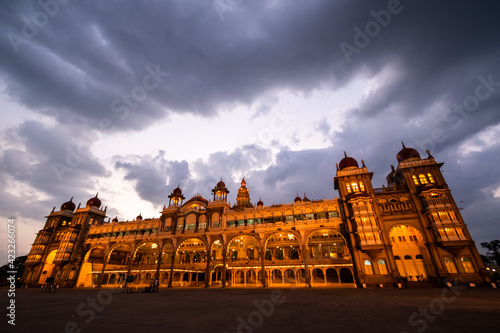 The historic Mysore Palace of the Wodeyar dynasty illuminated in the evening.