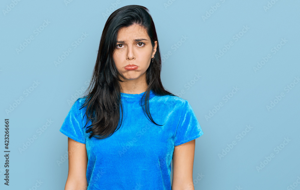 Young hispanic woman wearing casual clothes depressed and worry for distress, crying angry and afraid. sad expression. Young hispanic woman wearing casual clothes depressed and worry for distress, crying angry and afraid. sad expression.