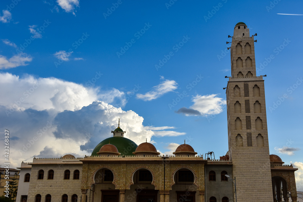 Beautiful cotton clouds behind a mosque in Algiers, Algeria