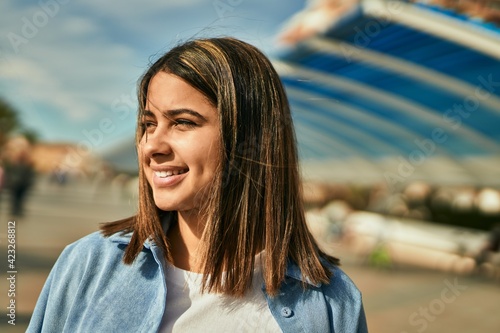 Young latin girl smiling happy standing at the city. © Krakenimages.com