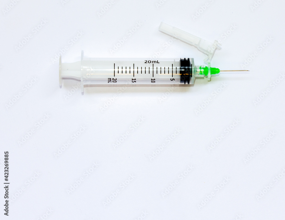 Disposable syringe with needle on white background top view. Science in times of pandemic Coronavirus Covid-19 Disposable syringe with needle on white background top view. Science in times of pandemic Coronavirus Covid-19