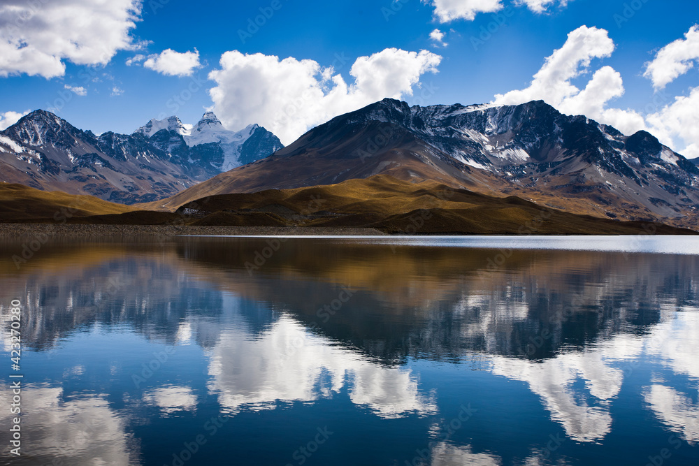 Reflections of Mt. Tuni Condoriri in the Tuni Reservoir below the Cordillera Real, Bolivia in winter. Reflections of Mt. Tuni Condoriri in the Tuni Reservoir below the Cordillera Real, Bolivia in winter.