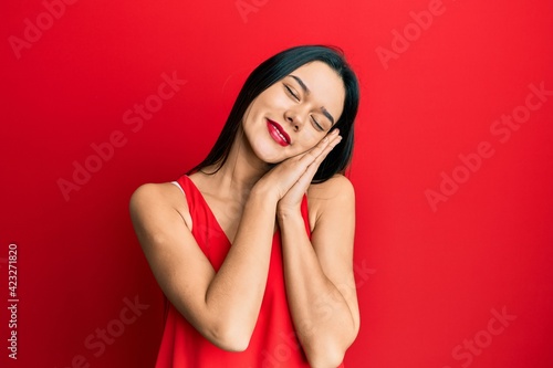 Wallpaper Mural Young hispanic girl wearing casual style with sleeveless shirt sleeping tired dreaming and posing with hands together while smiling with closed eyes. Torontodigital.ca