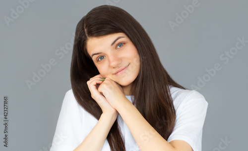 Portrait of beautiful woman posing gesture isolated on gray studio background