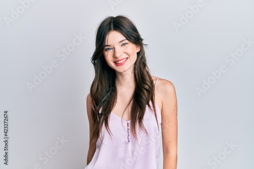 Young beautiful caucasian girl wearing casual clothes with a happy and cool smile on face. lucky person.