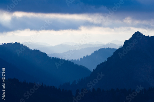 View of hills and ridges at dusk from Gothic Basin, Mount Baker-Snoqualmie National Forest, Washington.      photo