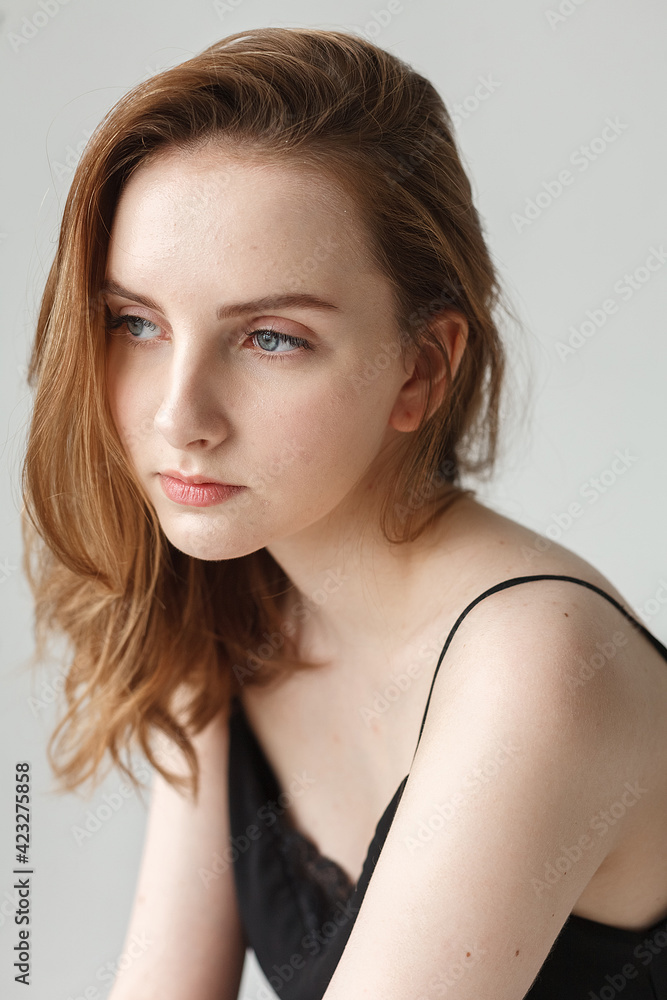 cute young pretty woman with long hair in black top posing on white background cute young pretty woman with long hair in black top posing on white background