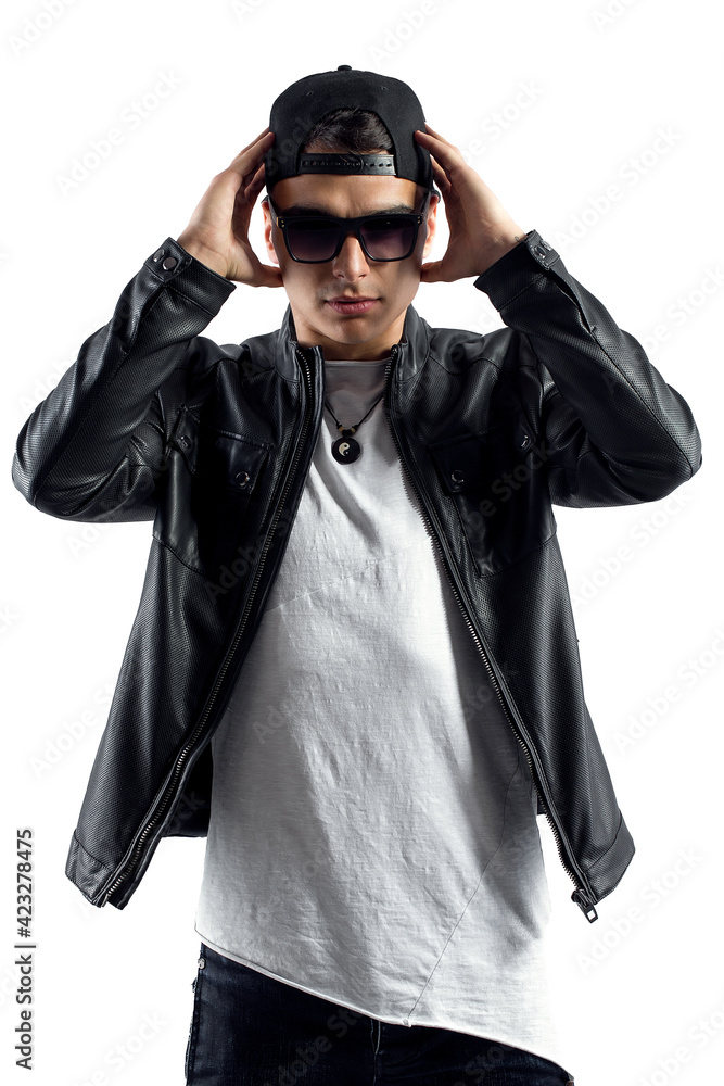 Fashion portrait of young handsome man. Cool rap dj, electro house music, deep house, mens fashion style,black style, leather jacket, rap, cat, b-boy, freestyler, singer, talented rap singer Fashion portrait of young handsome man. Cool rap dj, electro house music, deep house, mens fashion style,black style, leather jacket, rap, cat, b-boy, freestyler, singer, talented rap singer