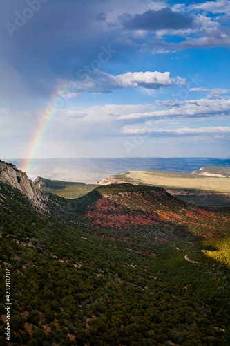 A rainbow & panoramic views of Dinosaur National Monument in NW Colorado during summer.   photo