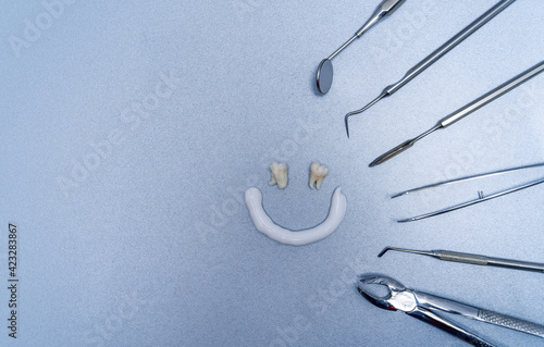 Dentist equipment for work. Composition of smiling face and different tools.