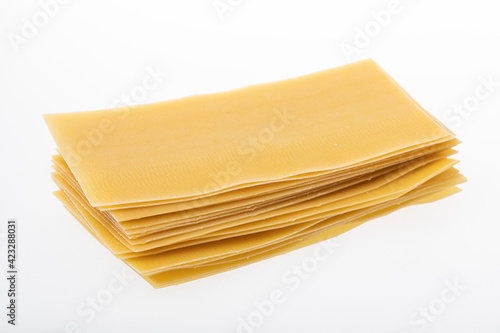 Uncooked lasagna sheets isolated on white