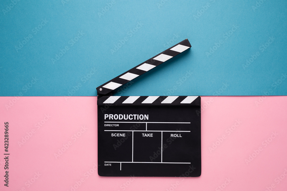 Filmmaker profession. Classic director empty film making clapperboard or movie slate isolated on pink and blue background. Video production film cinema industry concept. Flat lay top view copy space 