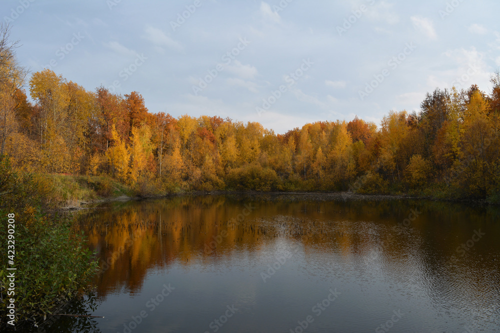 Beautiful autumn landscape with lake and colorful trees on its bank. Beautiful autumn landscape with lake and colorful trees on its bank.