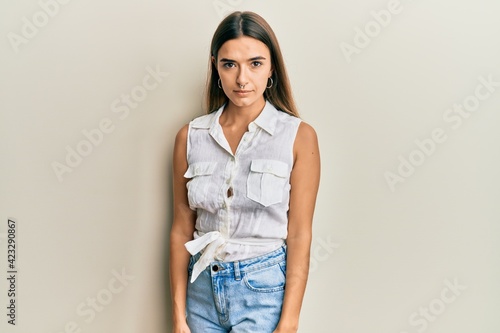 Beautiful young woman standing confident looking at the camera