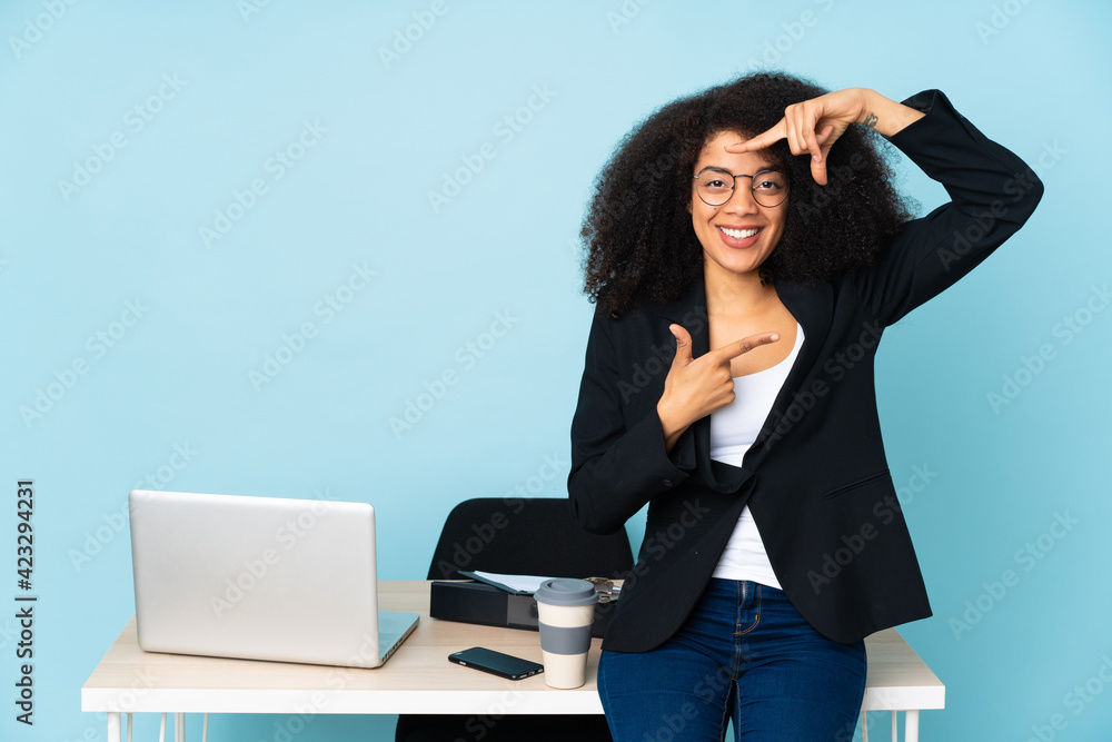 African american business woman working in her workplace focusing face. Framing symbol African american business woman working in her workplace focusing face. Framing symbol