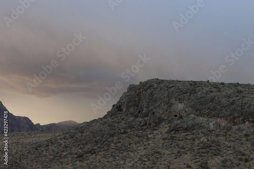 overcast day with clouds over mountain