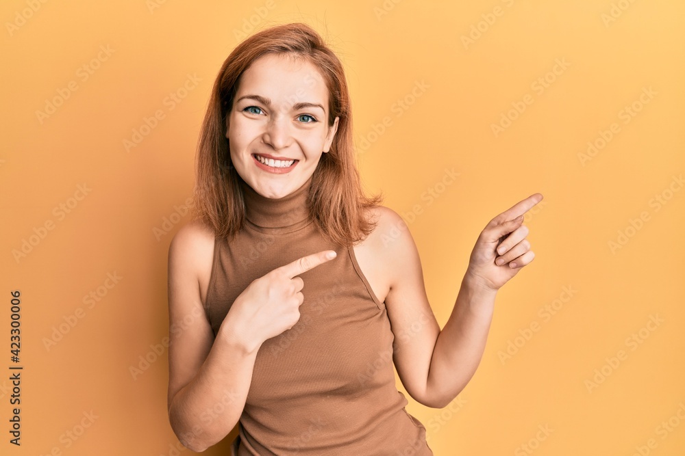 Young caucasian woman wearing casual style with sleeveless dress smiling and looking at the camera pointing with two hands and fingers to the side. Young caucasian woman wearing casual style with sleeveless dress smiling and looking at the camera pointing with two hands and fingers to the side.