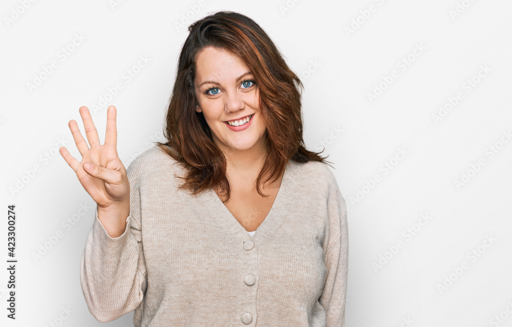 Young plus size woman wearing casual clothes showing and pointing up with fingers number four while smiling confident and happy. Young plus size woman wearing casual clothes showing and pointing up with fingers number four while smiling confident and happy.
