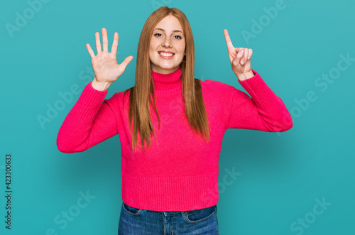 Young irish woman wearing casual clothes showing and pointing up with fingers number six while smiling confident and happy.