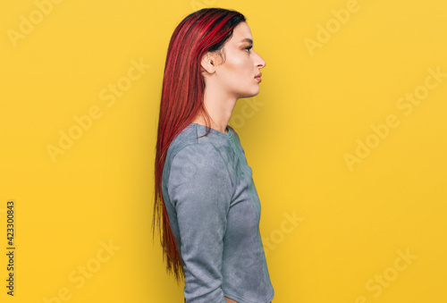 Young caucasian woman wearing casual clothes looking to side, relax profile pose with natural face with confident smile. © Krakenimages.com