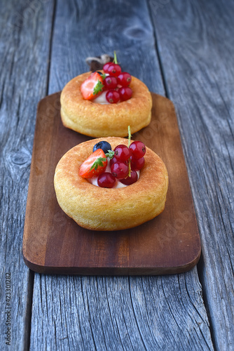 Savarin with diplomat cream and berries  photo