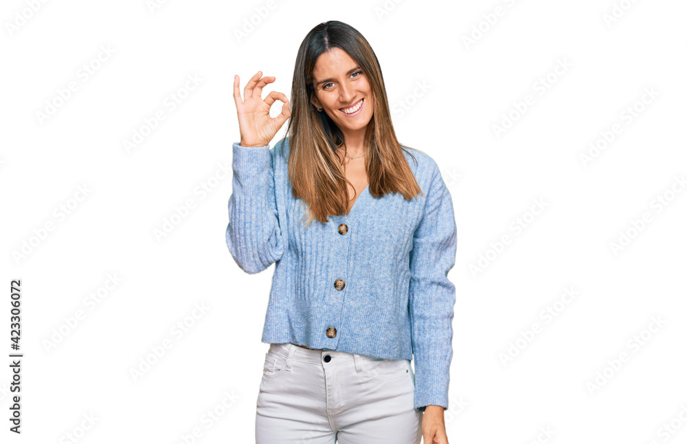 Young woman wearing casual clothes smiling positive doing ok sign with hand and fingers. successful expression. Young woman wearing casual clothes smiling positive doing ok sign with hand and fingers. successful expression.