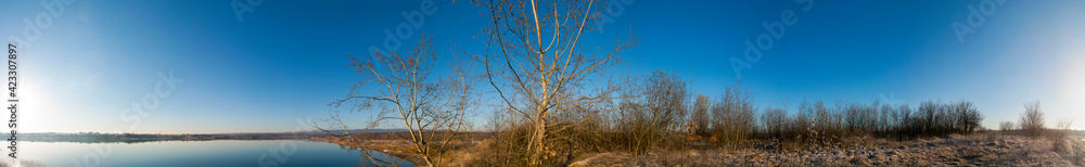 Early spring on a beautiful lake. Blue sky, cloudless and clear. Early spring on a beautiful lake. Blue sky, cloudless and clear.
