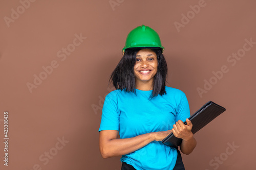 portrait of an attractive young black female contractor wearing a hard hat