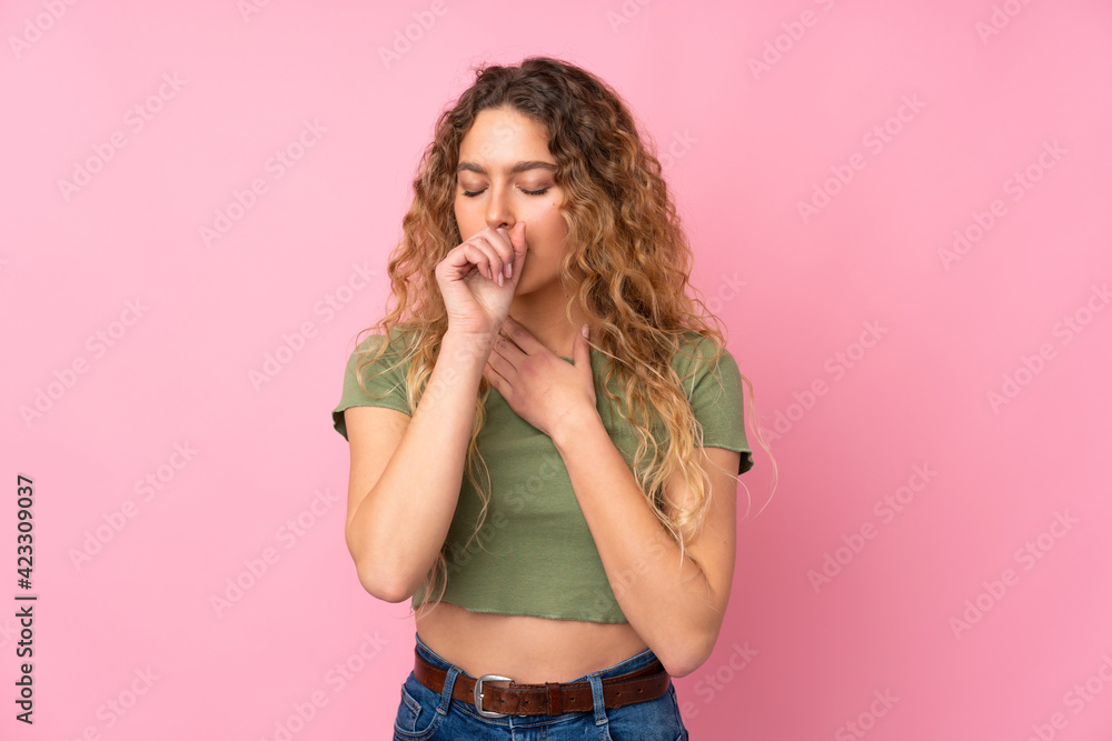 Young blonde woman with curly hair isolated on pink background is suffering with cough and feeling bad Young blonde woman with curly hair isolated on pink background is suffering with cough and feeling bad