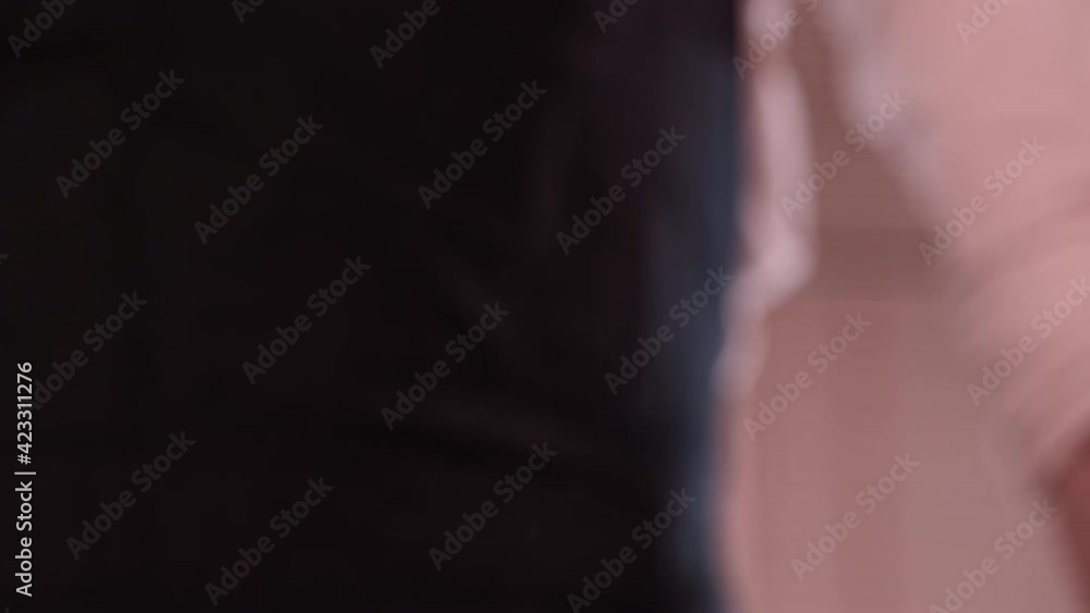 Close-up of baker pours flour in kitchen. Action. Baker sprinkles pinch of flour on baking. Professional Baker and baking cooking with love