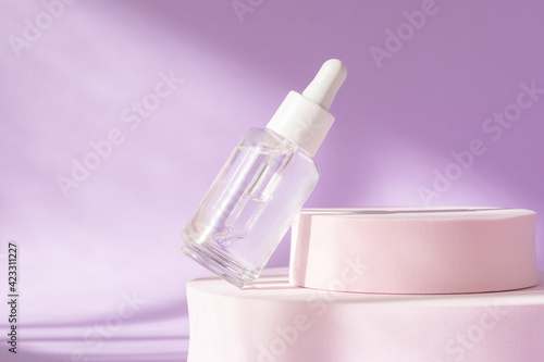 Hyaluronic acid, serum skincare glass bottle on lilac pink podium pedestal. Serum product cosmetic with peptide and collagen. Modern brand cosmetics packaging with shadow. Cosmetic showcase