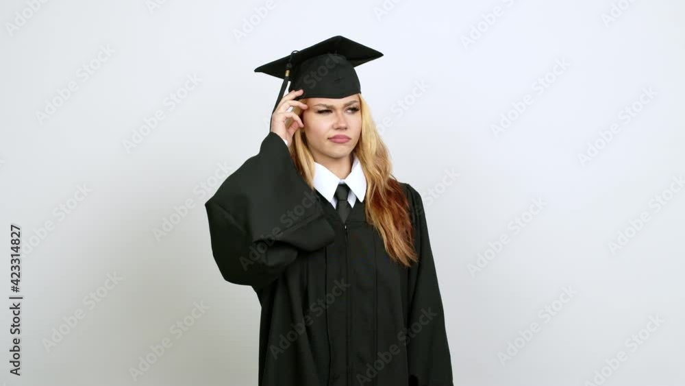 Young blonde teenager girl with graduation gown having doubts while scratching head over isolated background Young blonde teenager girl with graduation gown having doubts while scratching head over isolated background
