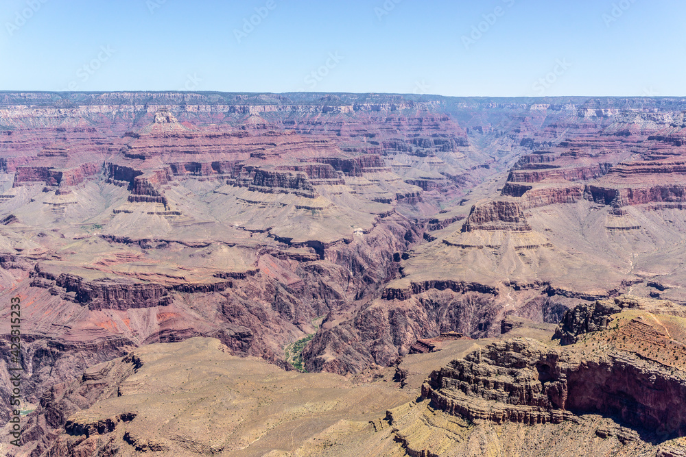 Clear skies and The Grand Canyon. that is a huge valley cut by the Colorado River. Clear skies and The Grand Canyon. that is a huge valley cut by the Colorado River.