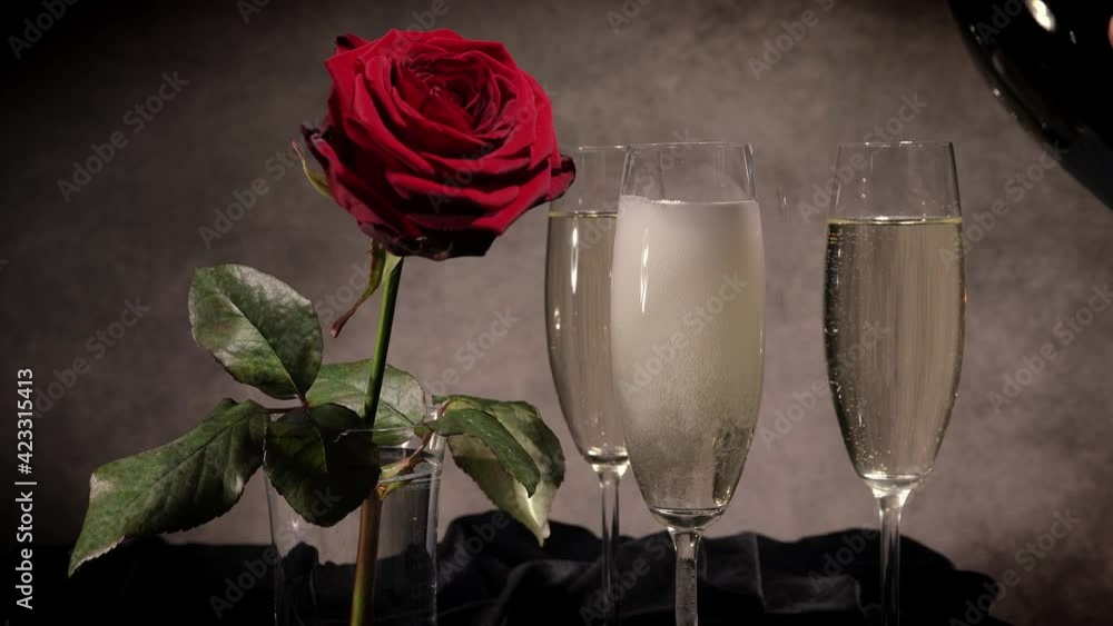 Champagne and red roses in close-up view - studio photography Champagne and red roses in close-up view - studio photography