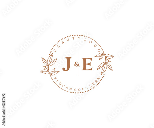 initial JE letters Beautiful floral feminine editable premade monoline logo suitable for spa salon skin hair beauty boutique and cosmetic company. photo