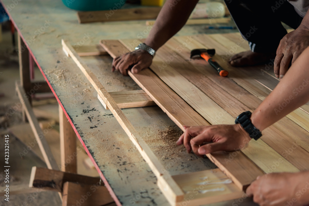 Carpenter build furniture at wood factory for sale Carpenter build furniture at wood factory for sale