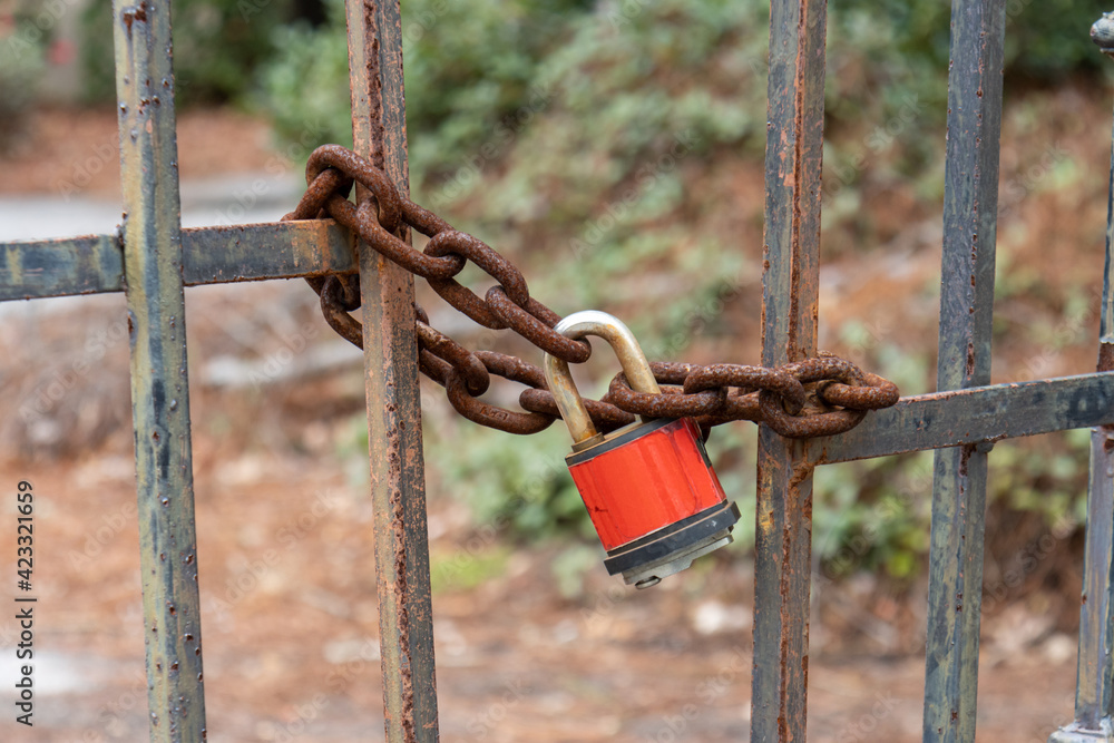 padlock and chain on the fence padlock and chain on the fence